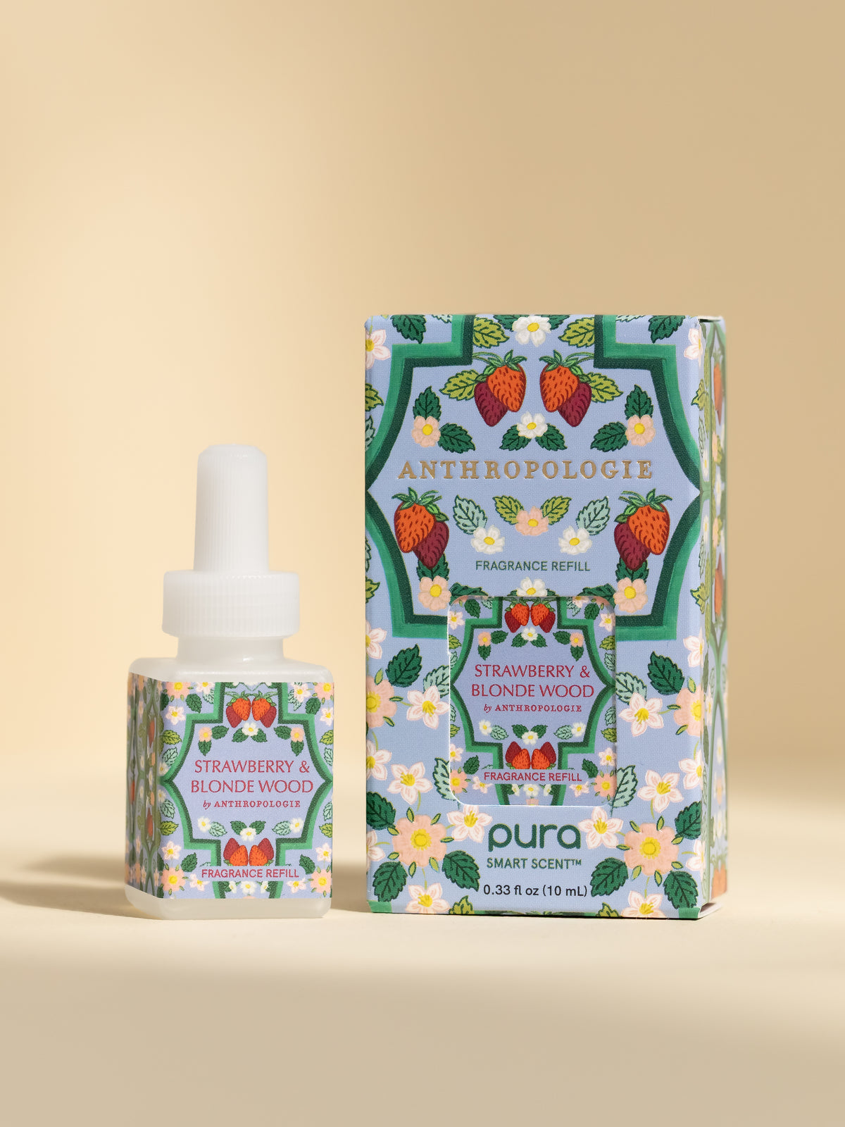 Anthropologie Strawberry & Blonde Wood fragrance vial and packaging on a beige background
