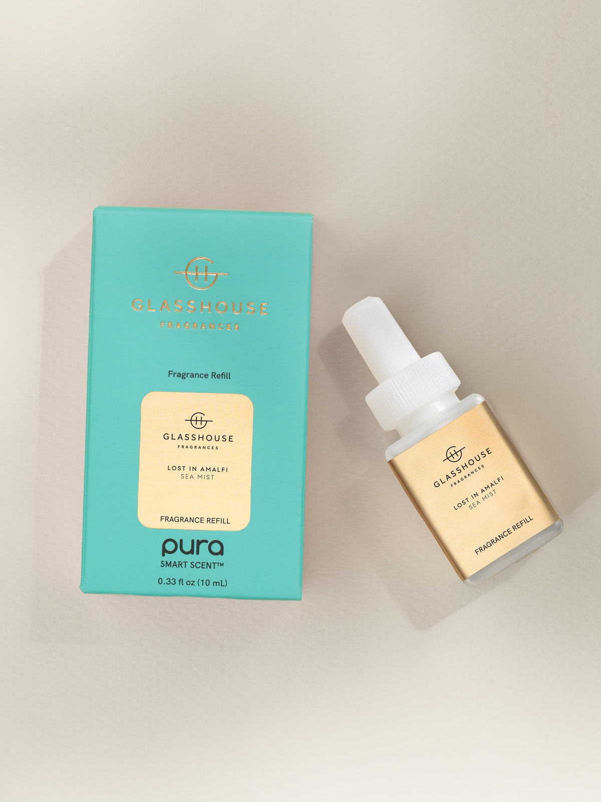 Glasshouse Fragrances Lost in Amalfi fragrance vial and packaging on a beige background