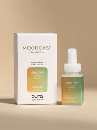 Moodcast Girls Trip fragrance vial and packaging on a beige background
