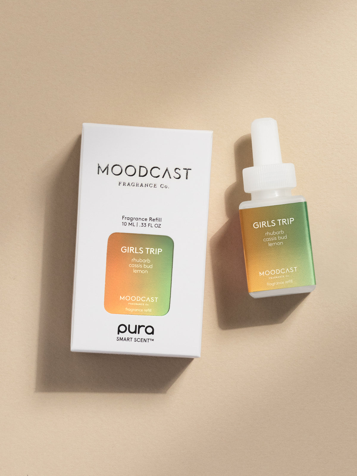Moodcast Girls Trip fragrance vial and packaging on a beige background